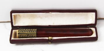 A 1950`s cigarette holder, with unusual decorative tip, in original box