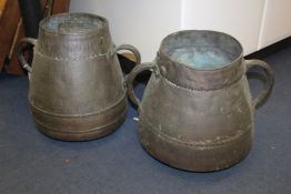 A pair of Middle Eastern twin handled copper pots, 19th century, 16in. A pair of Middle Eastern twin