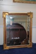 A Continental rectangular gilt wall mirror, W.2ft 4in. A Continental rectangular gilt wall mirror,