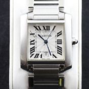 A gentleman`s modern stainless steel Cartier Tank Francaise automatic wrist watch, with Cartier box.