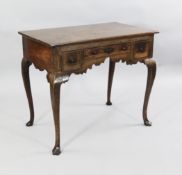 An 18th century oak lowboy, W.2ft 10in. An 18th century oak lowboy, fitted three frieze drawers with
