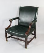 A George III style mahogany Gainsborough chair, A George III style mahogany Gainsborough chair, with