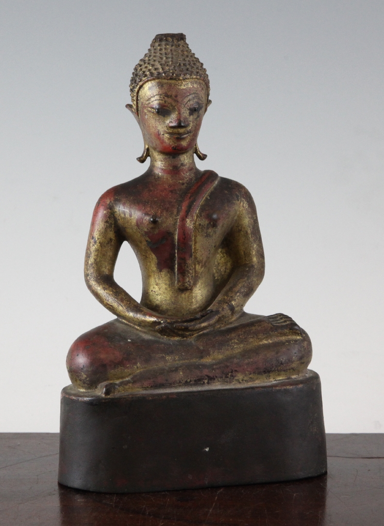 A South East Asian gilt bronze seated figure of Buddha, 19th century or earlier, 9.5in. A South East
