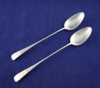 A pair of George III Scottish silver Old English pattern basting spoons, 12.25in. A pair of George