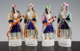Two pairs of Staffordshire standing figures of Turkish musicians, mid 19th century, 8in. and 8.25in.