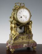 An early 20th century French ormolu and rouge marble mantel clock, 15in. An early 20th century