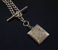 A 9ct gold curb link chain and locket. A 9ct gold curb link chain, 19in and a gold locket, on 9ct