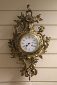 A French brass cartel clock, 21in. A French brass cartel clock, with enamelled Roman dial, 21in.