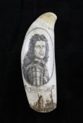 A scrimshaw whales tooth, 7in. A scrimshaw whales tooth, depicting an image of William III within an