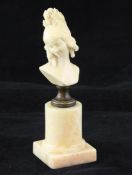 A 19th century French carved ivory bust of a young female, overall 5.5in. A 19th century French