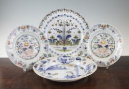 Two English delftware polychrome dishes and two similar plates, mid 18th century, 9in. Two English