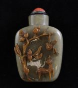 A Chinese chalcedony cameo snuff bottle, approx 2.25in.; white metal and coral stopper A Chinese