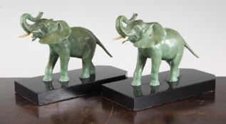 Attributed to Pierre Laurel. A pair of French Art Deco green patinated metal bookends, 8in.