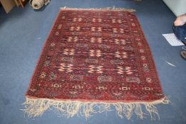 A Caucasian rug, 6ft 5in by 4ft 7in. A Caucasian rug, with eleven rows of alternating geometric