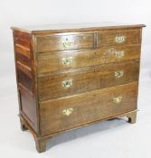 A George III oak chest, W.3ft 9in. A George III oak chest, of two short and three long graduated