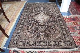 A 20th century oriental silk rug, 7ft 8in by 4ft 9in. A 20th century oriental silk rug, with central