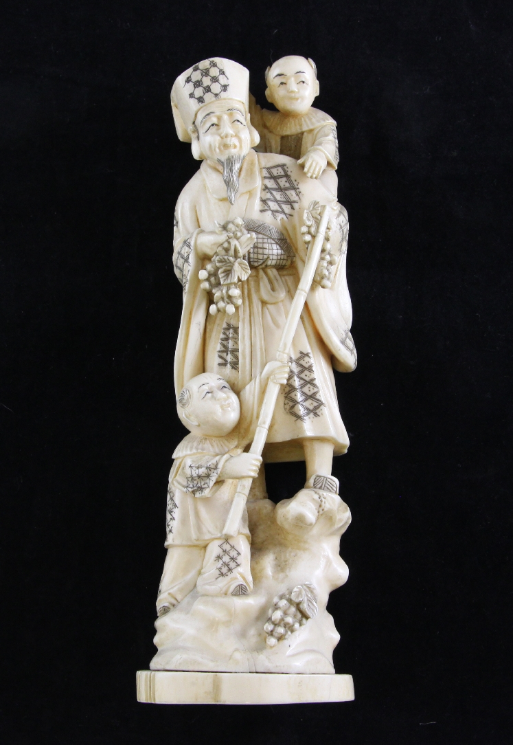 A Japanese Tokyo School walrus ivory okimono, 10in. A Japanese Tokyo School walrus ivory okimono,