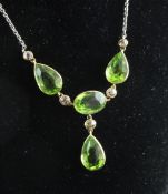 A gold and silver, diamond and peridot drop necklace, A gold and silver, diamond and peridot drop