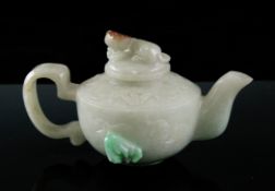 A Chinese jadeite wine pot and cover A Chinese jadeite wine pot and cover, the stone predominantly