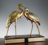 An Art Deco patinated metal figure group modelled as two herons, 20.5in. An Art Deco patinated metal