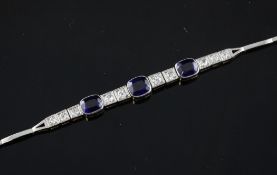 A gold, synthetic sapphire and diamond bracelet, 7in. A gold, synthetic sapphire and diamond