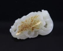 A Chinese white jade carving A Chinese white and russet skin jade carving, 18th/19th century, in the