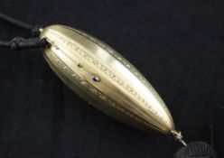 A 14ct gold minaudiere, 4in. A 14ct gold minaudiere, of torpedo form, with engine turned and