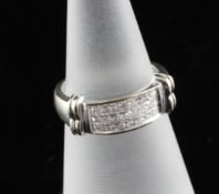 An 18ct white gold and princess cut diamond dress ring, size J. An 18ct white gold and princess
