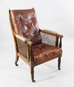 A 19th century bergere library chair, A 19th century bergere library chair, with buttoned leather