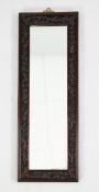 A Chinese rosewood rectangular wall mirror, W.2ft 4in. A Chinese rosewood rectangular wall mirror,