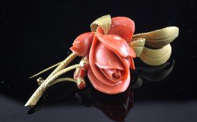 A 14ct gold and coral set flower brooch, 3in. A 14ct gold and coral set flower brooch, gross 33.6