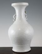 A Chinese white glazed baluster vase A Chinese white glazed baluster vase, late 19th / early 20th