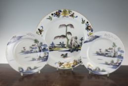 A pair of English delftware polychrome plates and a Delft polychrome dish, mid 18th century, 13.5in.