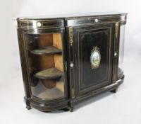 A Victorian ebonised porcelain and gilt metal mounted credenza, W.5ft 1in. A Victorian ebonised