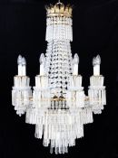 A large pair of brass and cut glass lustre hung chandeliers A large pair of brass and cut glass