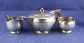 A 1930`s Art Deco silver three piece tea set, gross 21 oz. A 1930`s Art Deco silver three piece