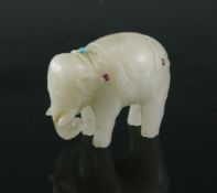 A Mughal style white jade figure of a standing elephant, 19th century or later, approx. 2in., (