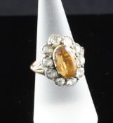 An early 19th century foil backed topaz and diamond set dress ring, size M. An early 19th century