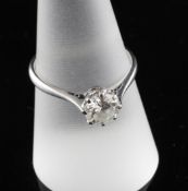 An 18ct white gold and solitaire diamond ring, size Q. An 18ct white gold and solitaire diamond