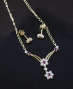 An 18ct gold ruby and diamond set suite of jewellery necklace 14in. An 18ct gold ruby and diamond