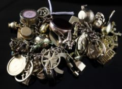 A 9ct gold charm bracelet hung with thirty eight charms, A 9ct gold charm bracelet hung with