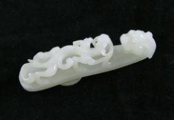 A Chinese white jade belt hook, 18th / 19th century, 3.25in. (approx.8.3cm) A Chinese white jade