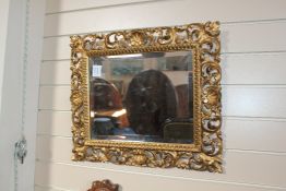 An Italian Florentine giltwood rectangular wall mirror, 1ft 9in. x 1ft 6in. An Italian Florentine