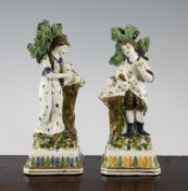 A pair of Staffordshire pearlware figures, c.1790-1800, 9in. and 9.2in. A pair of Staffordshire