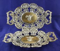 A pair of 19th century continental silver two handled wall plaques, gross 26 oz. A pair of 19th