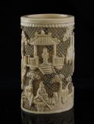 A Chinese ivory brushpot, late 19th century, 6.75in. (17cm) A Chinese ivory brushpot, late 19th