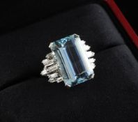 A late 1960`s platinum, aquamarine and diamond set dress ring, by Cartier, London, size P. A late