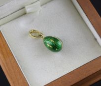 A modern 18ct gold and green guilloche enamel egg pendant by Victor Mayer, Workmaster of Faberge,