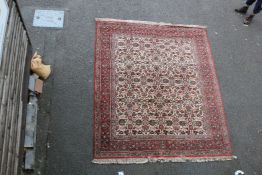 An early 20th century Tabriz rug, 9ft 10in by 8ft 2in. An early 20th century Tabriz rug, with