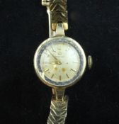An early 1960`s lady`s 9ct gold Omega manual wind wrist watch, An early 1960`s lady`s 9ct gold Omega